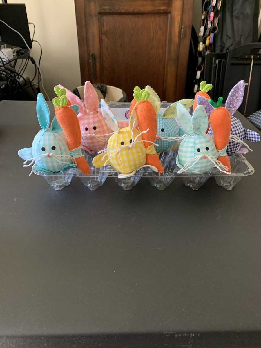 Pastel Easter bunny and egg handmade craft pieces grouped together.