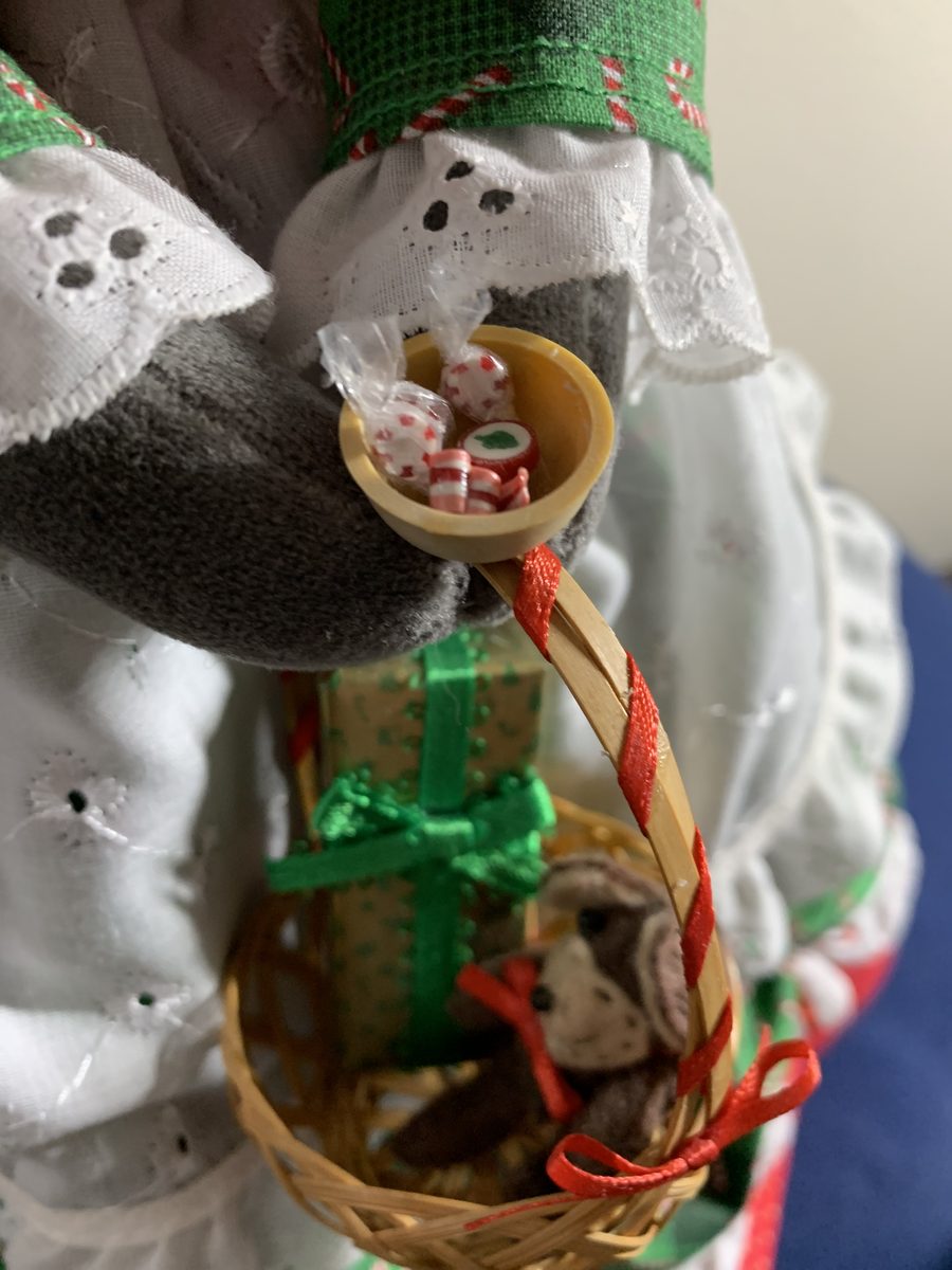 Tiny handmade toys, candies, and gift pieces arranged like miniature treasures.
