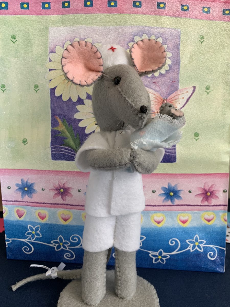 A nurse mouse and newborn mouse, handmade with tiny storybook sweetness.