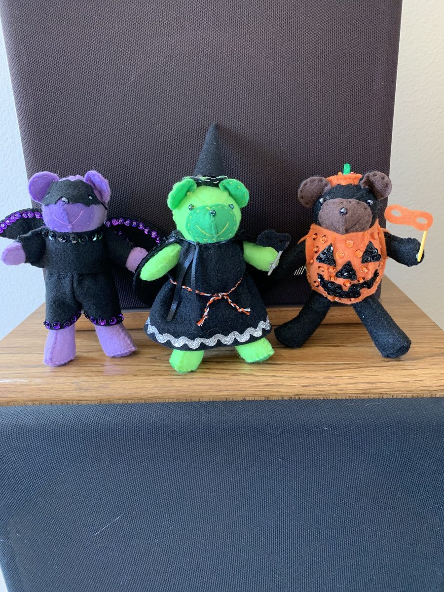 Halloween-themed handmade mouse figures arranged in a festive lineup.